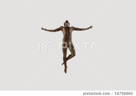 Modern ballet dancer. Contemporary art ballet. Young flexible athletic man. Modern ballet dancer. Contemporary art ballet. Young flexible athletic man. 58798860
