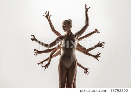 The group of modern ballet dancers. Contemporary art ballet. Young flexible athletic men and women. The group of modern ballet dancers. Contemporary art ballet. Young flexible athletic men and women. 58798890