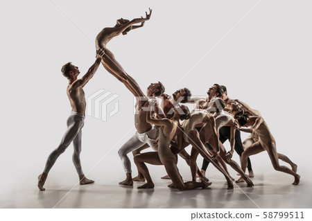 The group of modern ballet dancers. Contemporary art ballet. Young flexible athletic men and women. The group of modern ballet dancers. Contemporary art ballet. Young flexible athletic men and women. 58799511