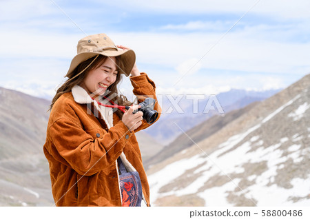 Young woman enjoy her camera in journey 58800486