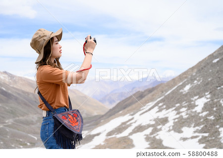 Young woman enjoy her camera in journey 58800488