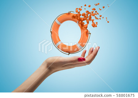 Cose-up of woman's hand facing up and levitating miniatured orange lifebuoy which started dissolving Cose-up of woman's hand facing up and levitating miniatured orange lifebuoy which started dissolving 58801675