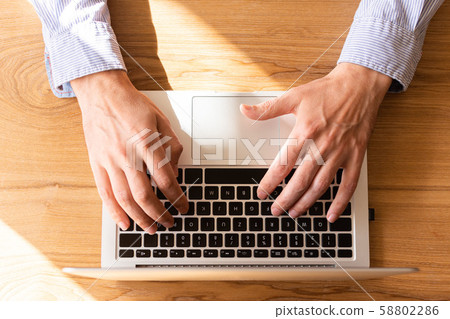 Businessman working on laptop Businessman working on laptop 58802286