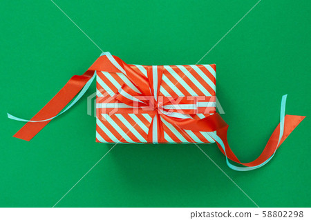 Background with red and white striped gift box Background with red and white striped gift box 58802298