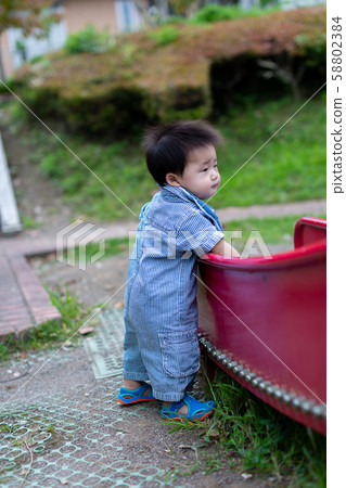 Infants playing in the park Infants playing in the park 58802384