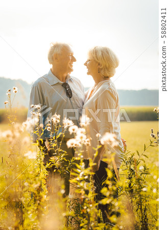Senior woman and man hugging still being in love 58802411