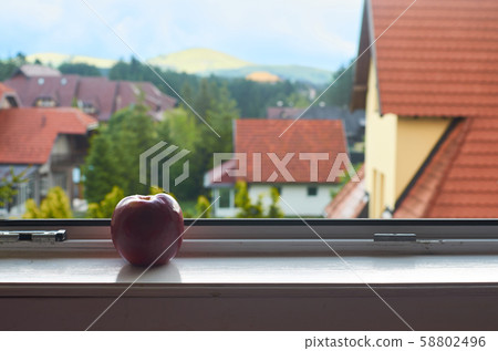Red roofs and red apple 58802496