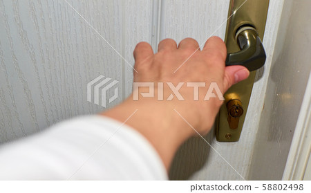 Hand holding handler - close-up Hand holding handler - close-up 58802498