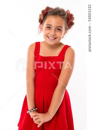 Teenage girl with long blonde hair, dyed tips pink, stuffed in two tufts, in red dress, with red 58803282