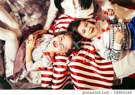 cute family at Christmas, mother son and daughter together having fun, lifestyle people at holiday 58803284