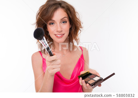 Young beautiful girl with wavy brown hair, clean skin, flat teeth, beautiful smile, in pink jersey 58803832
