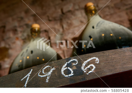 Vintage wine bottles in cellar. Shallow dof. Vintage wine bottles in cellar. Shallow dof. 58805428