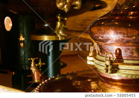 Detalis of medieval traditional distiller cube made from copper production of alcohol, cognac Detalis of medieval traditional distiller cube made from copper production of alcohol, cognac 58805455