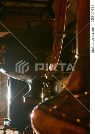 Detalis of medieval traditional distiller cube made from copper production of alcohol, cognac Detalis of medieval traditional distiller cube made from copper production of alcohol, cognac 58805458
