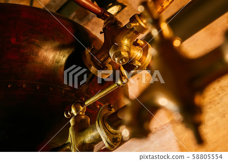Detalis of medieval traditional distiller cube made from copper production of alcohol, cognac Detalis of medieval traditional distiller cube made from copper production of alcohol, cognac 58805554