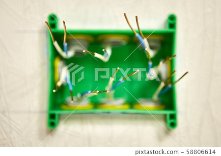 Bare copper wires in a junction box. 58806614