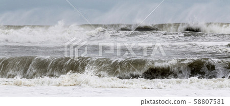 Rough ocean waves from tropical storm with heavy 58807581