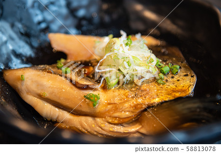 Salmon head in soy sauce 58813078