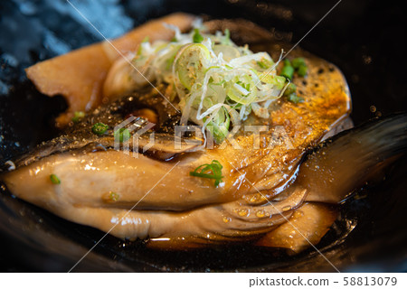Salmon head in soy sauce 58813079