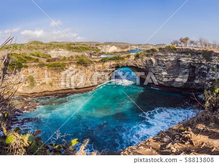 Landscape over Broken Beach in Nusa Penida, Indonesia Angel's BillaBong Beach. Popular tourist Landscape over Broken Beach in Nusa Penida, Indonesia Angel's BillaBong Beach. Popular tourist 58813808