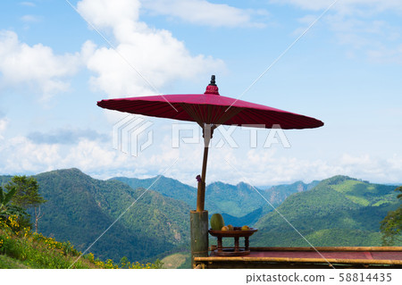 Wooden umbrella on balcony Wooden umbrella on balcony 58814435
