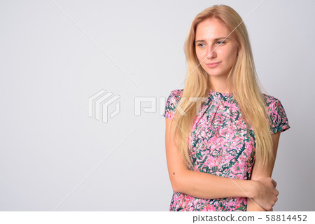 Portrait of young beautiful blonde woman looking down 58814452