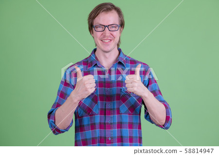 Happy young handsome hipster man with eyeglasses giving thumbs up Happy young handsome hipster man with eyeglasses giving thumbs up 58814947