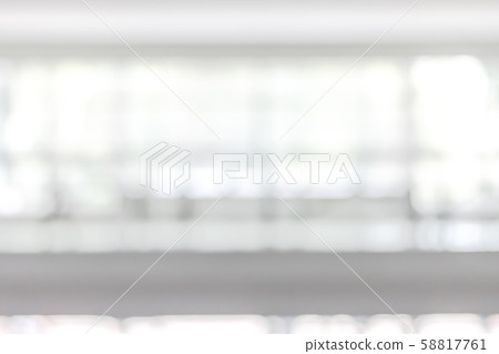 Blur business office background interior view empty lobby corridor hallway with glass wall white room and light bokeh 58817761