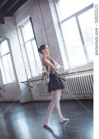 Young ballet dancer finished practice in studio active lifestyle Young ballet dancer finished practice in studio active lifestyle 58820123