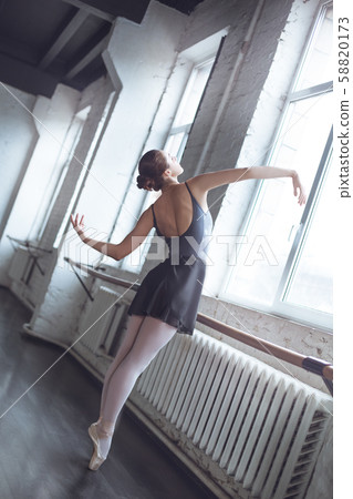 Young ballet dancer pdancing elegant in studio active lifestyle Young ballet dancer pdancing elegant in studio active lifestyle 58820173
