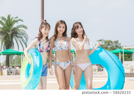 Woman enjoying the pool Woman enjoying the pool 58820235