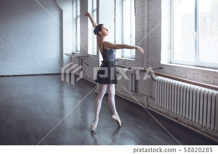 Young ballet dancer practice wearing skirt in studio active lifestyle 58820285