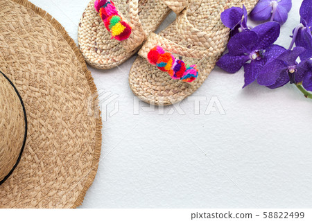 Bohemian straw wicker hat and slippers with purple orchid. Boho stile mockup. 58822499