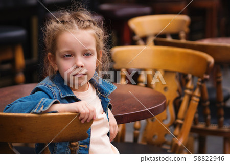 Little girl in a cafe Little girl in a cafe 58822946