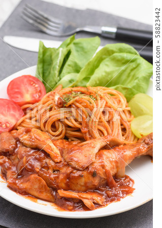 Chicken leg stewed in tomato sauce Chicken leg stewed in tomato sauce 58823442