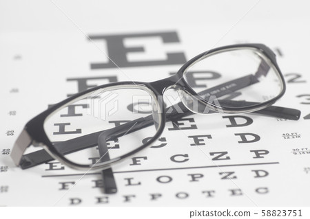 Eyeglasses on eyesight test chart 58823751