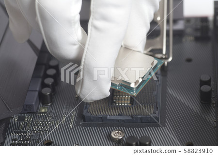 Computer technician wearing white gloves Computer technician wearing white gloves 58823910