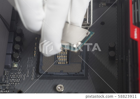 Computer technician wearing white gloves Computer technician wearing white gloves 58823911