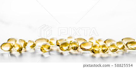 Vitamin D and golden Omega 3 pills for healthy 58825554