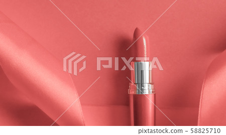 Luxury lipstick and silk ribbon on coral holiday 58825710