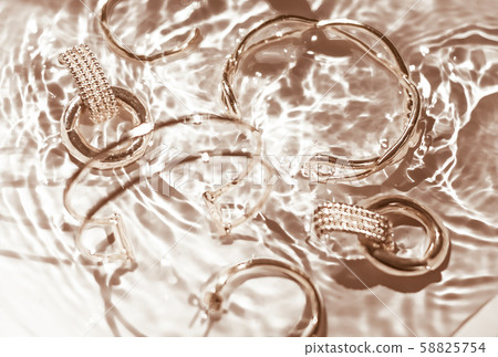Golden bracelets, earrings, rings, jewelery on 58825754