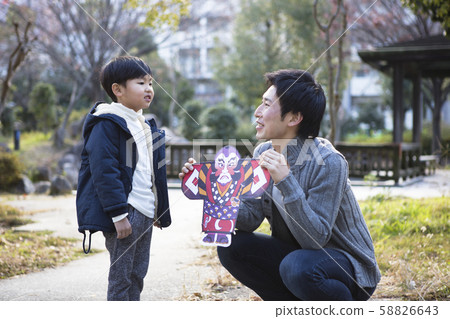 Father and son playing at New Year holidays 58826643