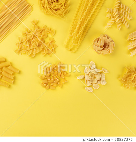 Italian pasta, shot from the top on a yellow background with copy space, a square flat lay banner Italian pasta, shot from the top on a yellow background with copy space, a square flat lay banner 58827375