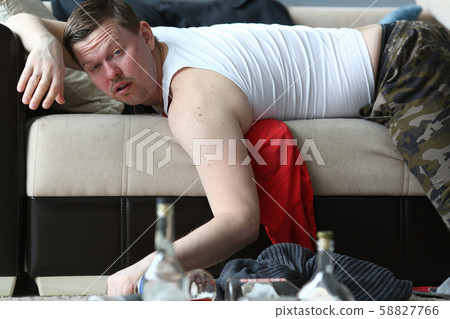 Concerned man lying on coach 58827766