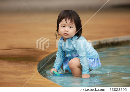 Girls playing in the water Girls playing in the water 58828293