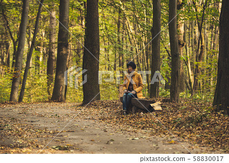 Hipster girl in a park 58830017