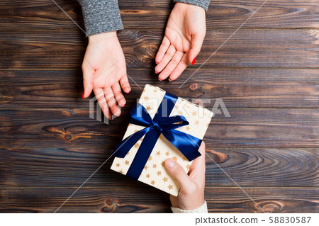 Top view of a woman and a man giving and receiving 58830587
