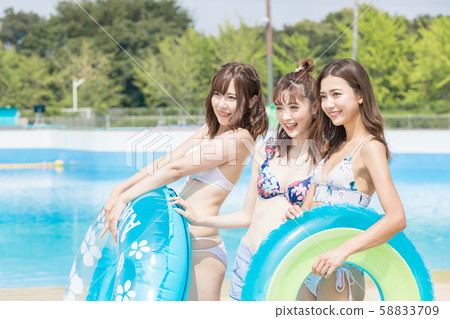 Woman enjoying in the pool Woman enjoying in the pool 58833709