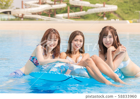 Woman enjoying in the pool 58833960