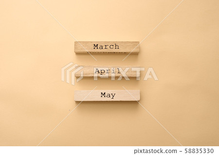 Wooden calendar spring months on wooden cubes. Top view Flat Lay Minimal 58835330